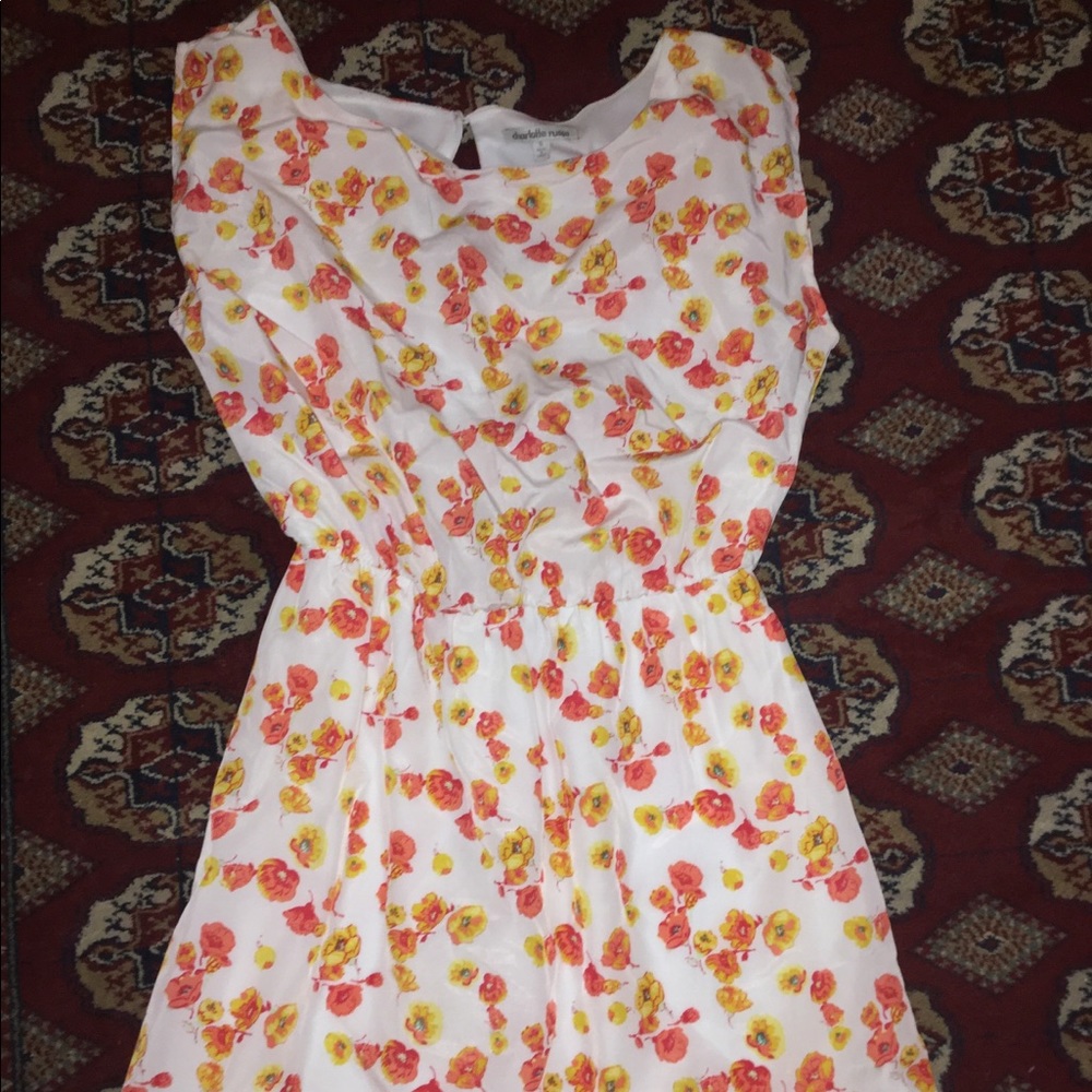 White dress with orange flowers.
